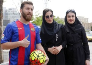 Iran's Reza Parastesh looks like Barcelona player Lionel Messi